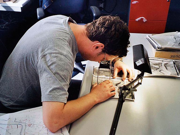 Viewing aerial photographs with a stereoscope